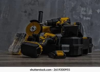 Cordless power tools and cases on a workbench